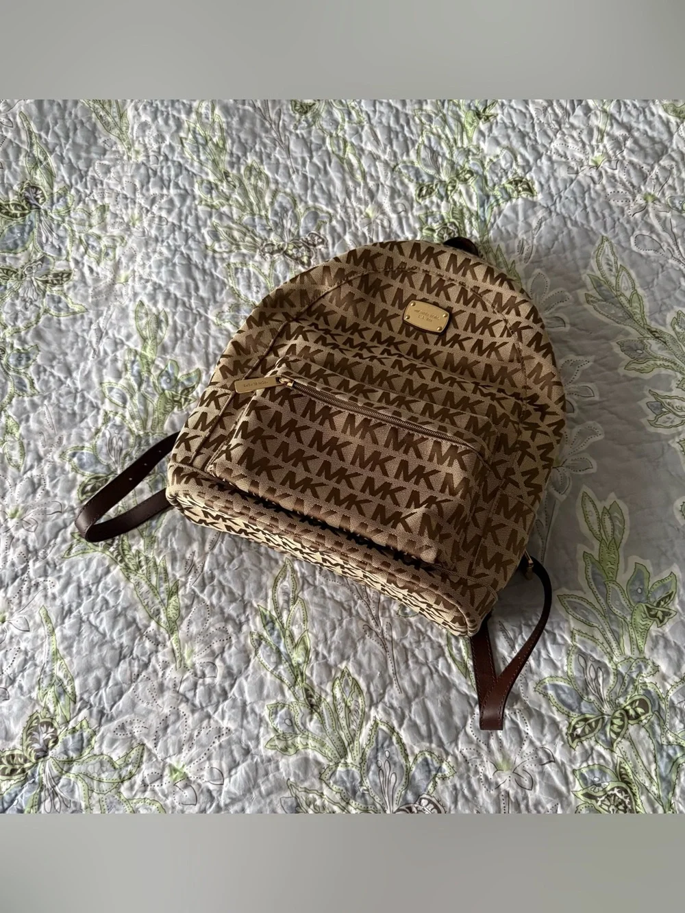 Michael Kors Monogram Logo Backpack with Gold Tone Hardware and Faux Leather Str